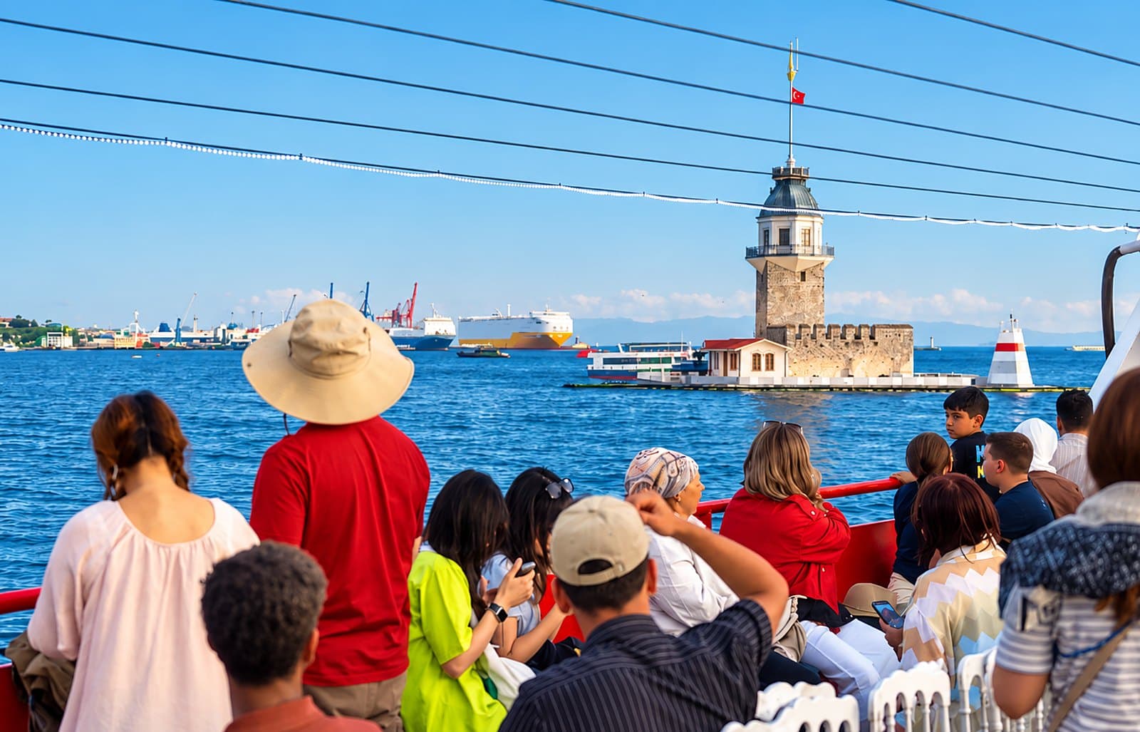 Guests on deck passing the Maiden’s Tower on a sunny day